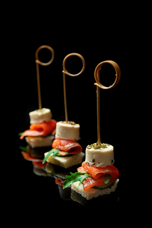 Gourmet canapes on black backgroundの写真素材