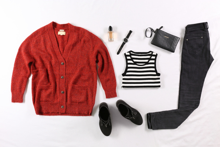 Modern clothes on bedの写真素材