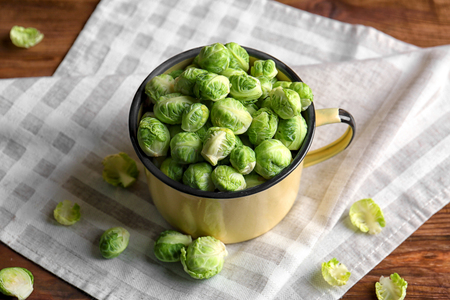 Brussels sprouts in mug on napkinの写真素材