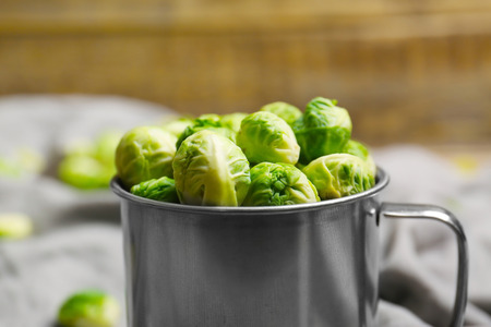 Brussels sprouts in metal mug, closeupの写真素材