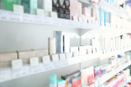 Blurred store shelves with various products backgroundの写真素材