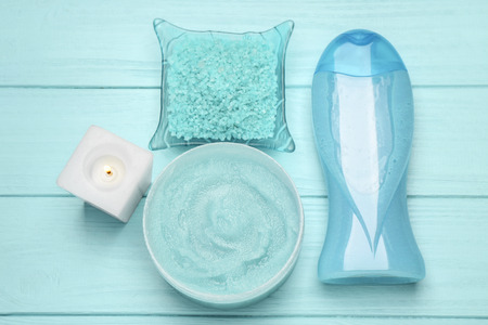 Spa treatments on blue wooden background