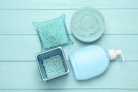 Spa treatments on blue wooden background