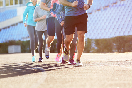 Sportsmen running at stadium