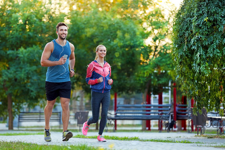 Sportsmen running in park