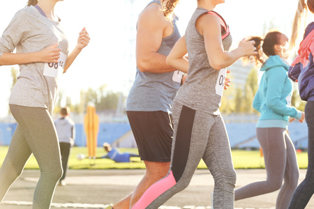 Sportsmen running at stadiumの写真素材