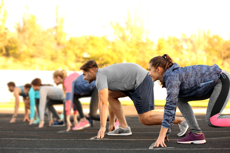 Sportsmen preparing to run at stadium