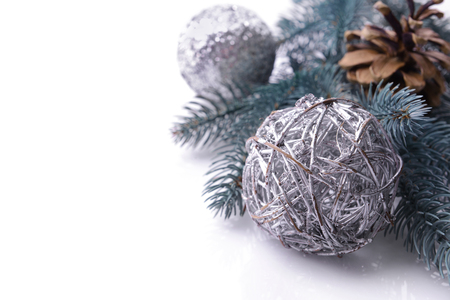 Composition of Christmas decor and coniferous branch on white background, close up viewの写真素材