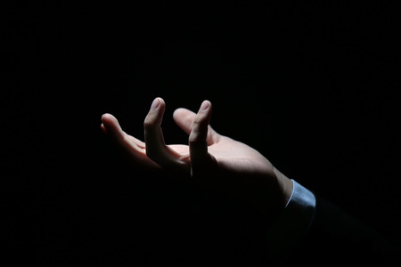 Hand of businessman in darknessの写真素材