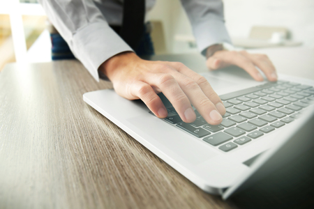 Businessman using laptop, close upの写真素材
