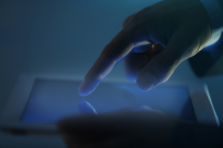 Businessman touching screen of modern tablet, closeupの写真素材