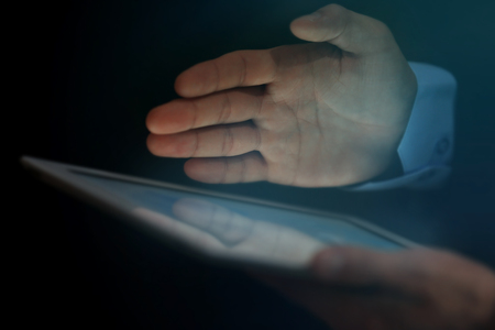 Businessman holding modern tablet, closeup