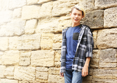 Cute teenager boy outdoorsの写真素材