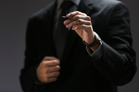 Businessman hand pointing, closeupの写真素材