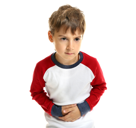 Little boy suffering from stomach ache, isolated on whiteの写真素材