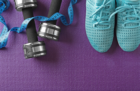 Sport clothes and equipment on color background, top viewの写真素材