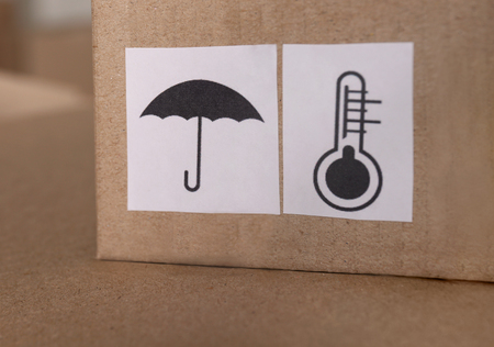 Carton boxes with warning sign, closeupの写真素材
