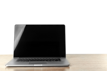 Modern laptop on wooden deskの写真素材