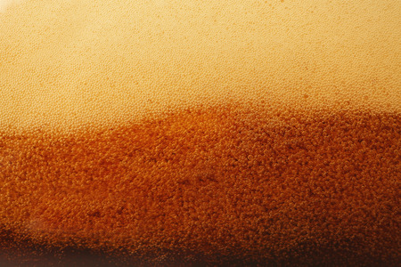 Dark beer bubbles closeup