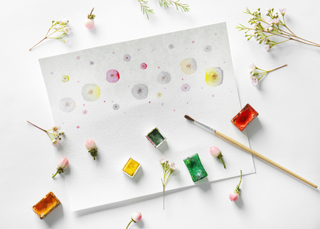 Watercolor painting with flowers on album sheetの写真素材