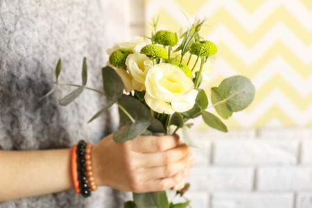 Woman holding bouquet of fresh flowersの写真素材