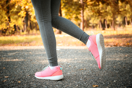 Runner legs on pathway in parkの写真素材