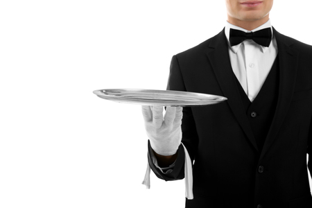 Male waiter holding tray on white backgroundの写真素材