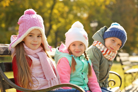 Group of children having fun walking in park