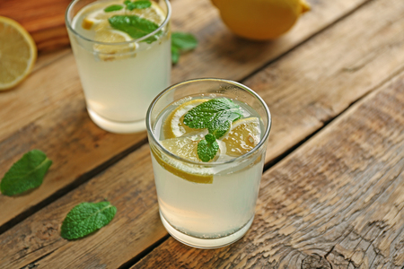 Glass of refreshing lemonade on tableの写真素材