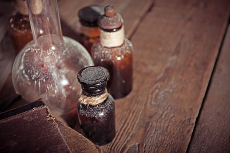 Vintage glass bottles on wooden background, closeupの写真素材