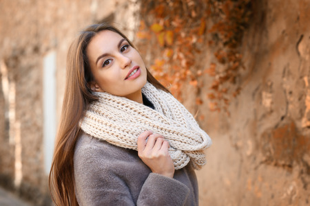 Beautiful young woman outdoors on sunny autumn dayの写真素材