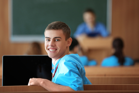 Smart male student at lecture indoorsの写真素材