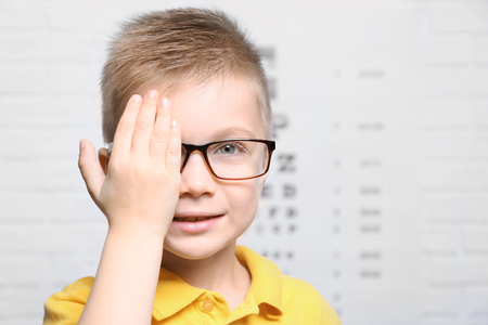 Little boy having eye test at ophthalmologist officeの写真素材