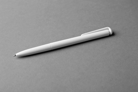 Blank ballpoint pen on grey backgroundの写真素材