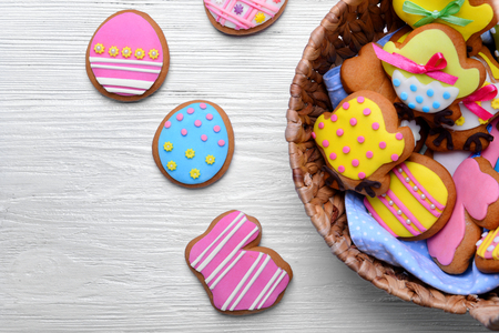 Closeup of tasty Easter cookies in wicker basket