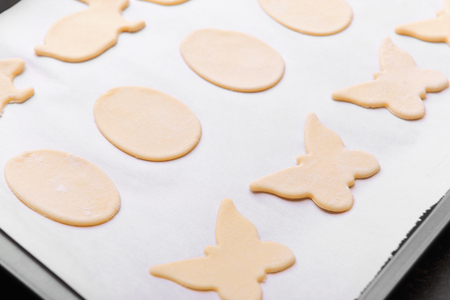 Raw Easter cookies on baking tray, closeupの写真素材