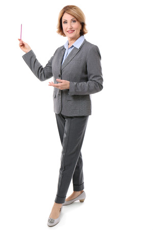 Middle-aged teacher pointing at something isolated on whiteの写真素材
