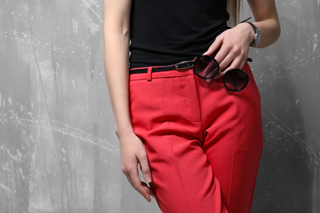 Beautiful young woman near grunge wall, closeupの写真素材