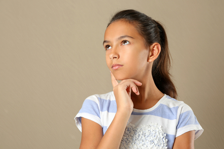 Cute pretty girl on color backgroundの写真素材