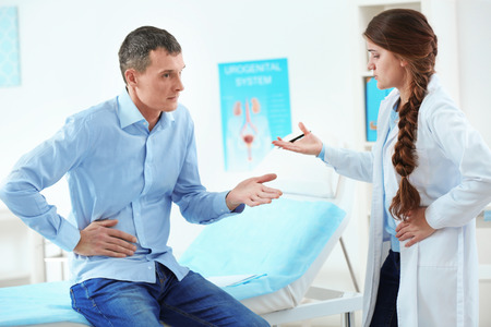 Young man visiting doctor at hospital