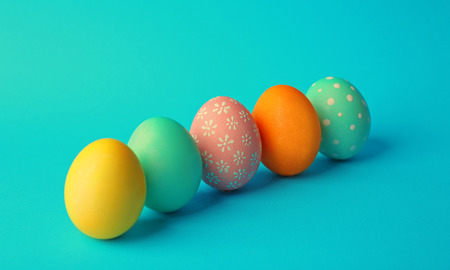 Colorful Easter eggs on blue background
