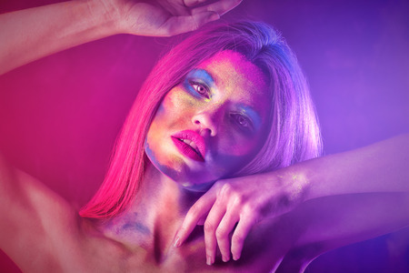 Beautiful woman with facial body-art, closeup