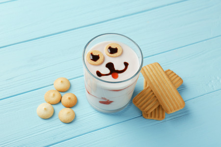 Baby cookies and milk cocktail on wooden backgroundの写真素材