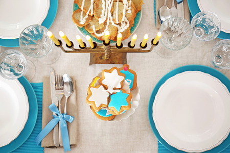 Beautiful table setting with menorah for Hanukkahの写真素材
