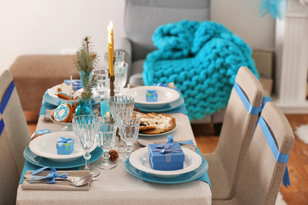 Table served for Hanukkah in living roomの写真素材