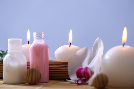 Spa composition with candles on color backgroundの写真素材