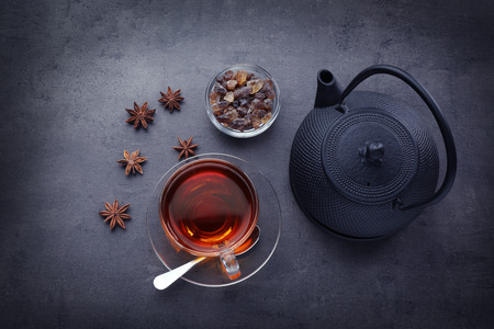 Cup of tea with teapot on gray tableの写真素材
