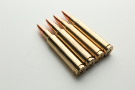 Rifle bullets on white backgroundの写真素材