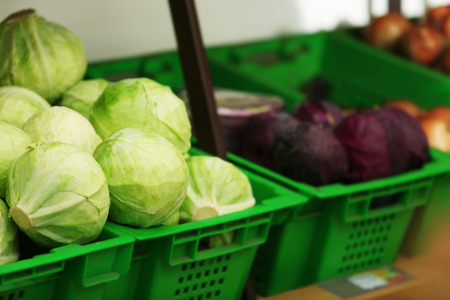 Baskets with vegetables in market