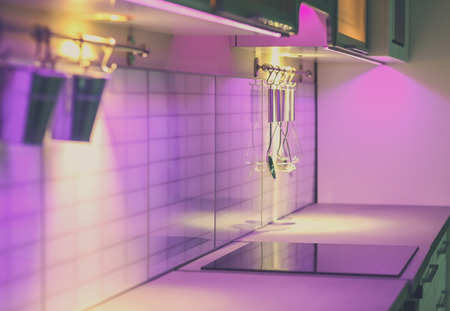 Modern kitchen interior with purple backlightの写真素材